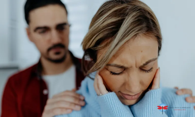 a wife feeling anxious and a husband trying to console her