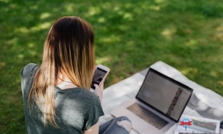 teenager using social media on her laptop and phone