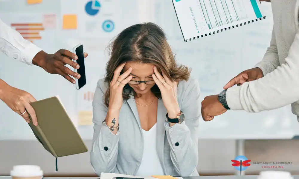 woman feeling overwhelmed to all all the work she needs to do